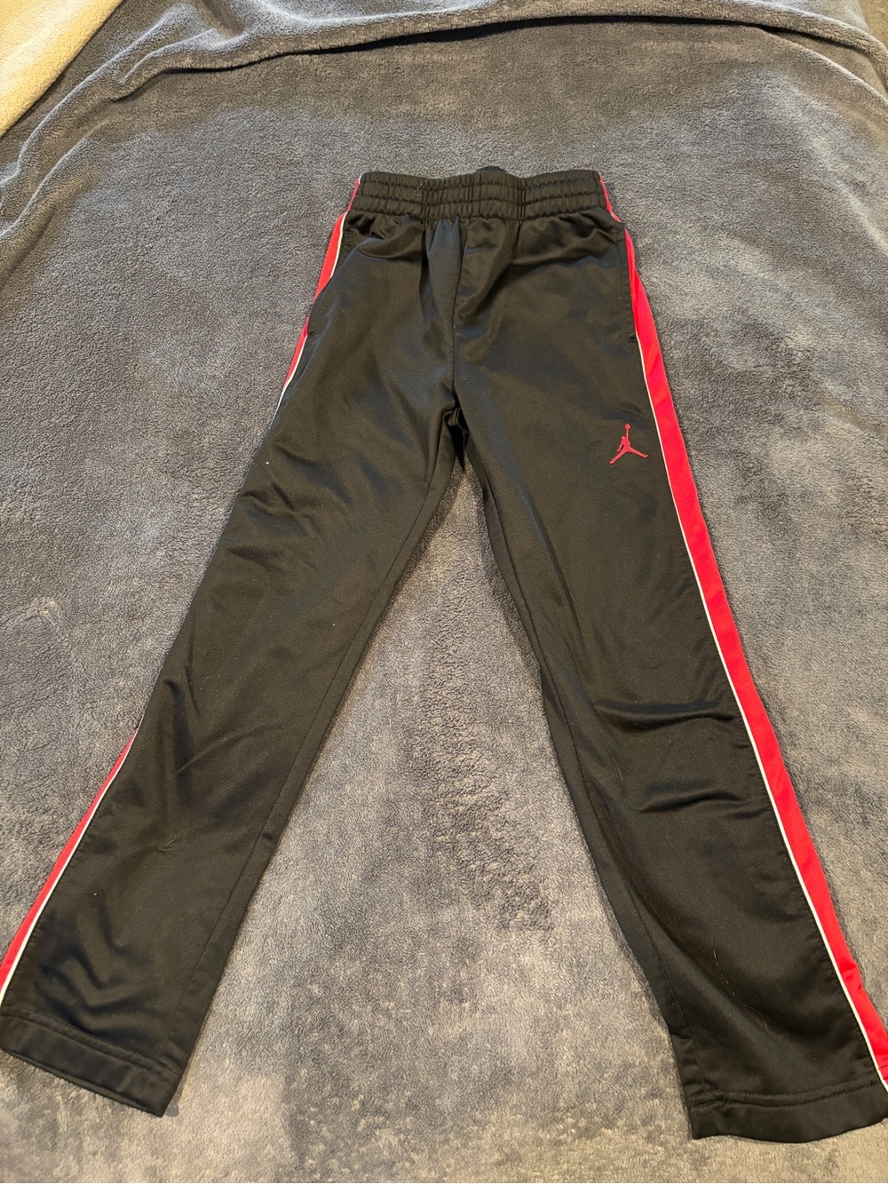 Jordan Kids Black Track Pants with Red Stripe boys size 7